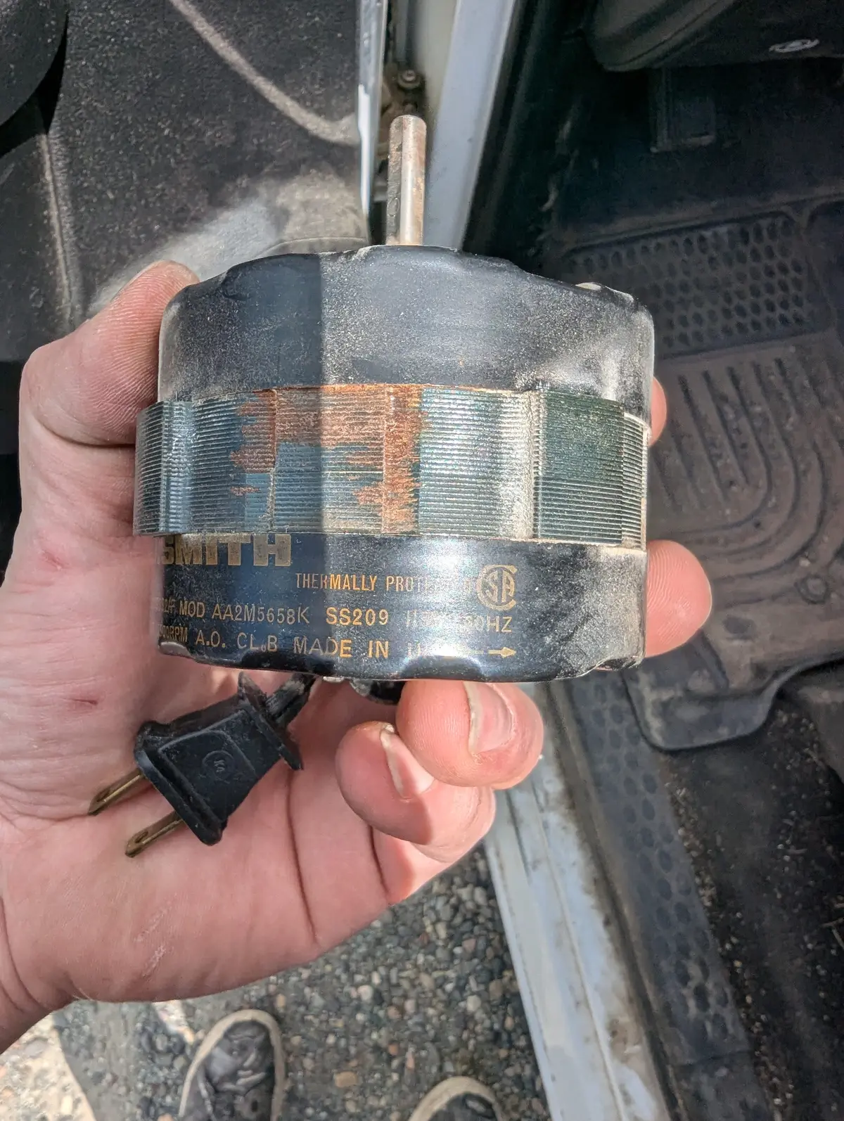 The plug-in motor out of the housing — a five-minute swap once matched